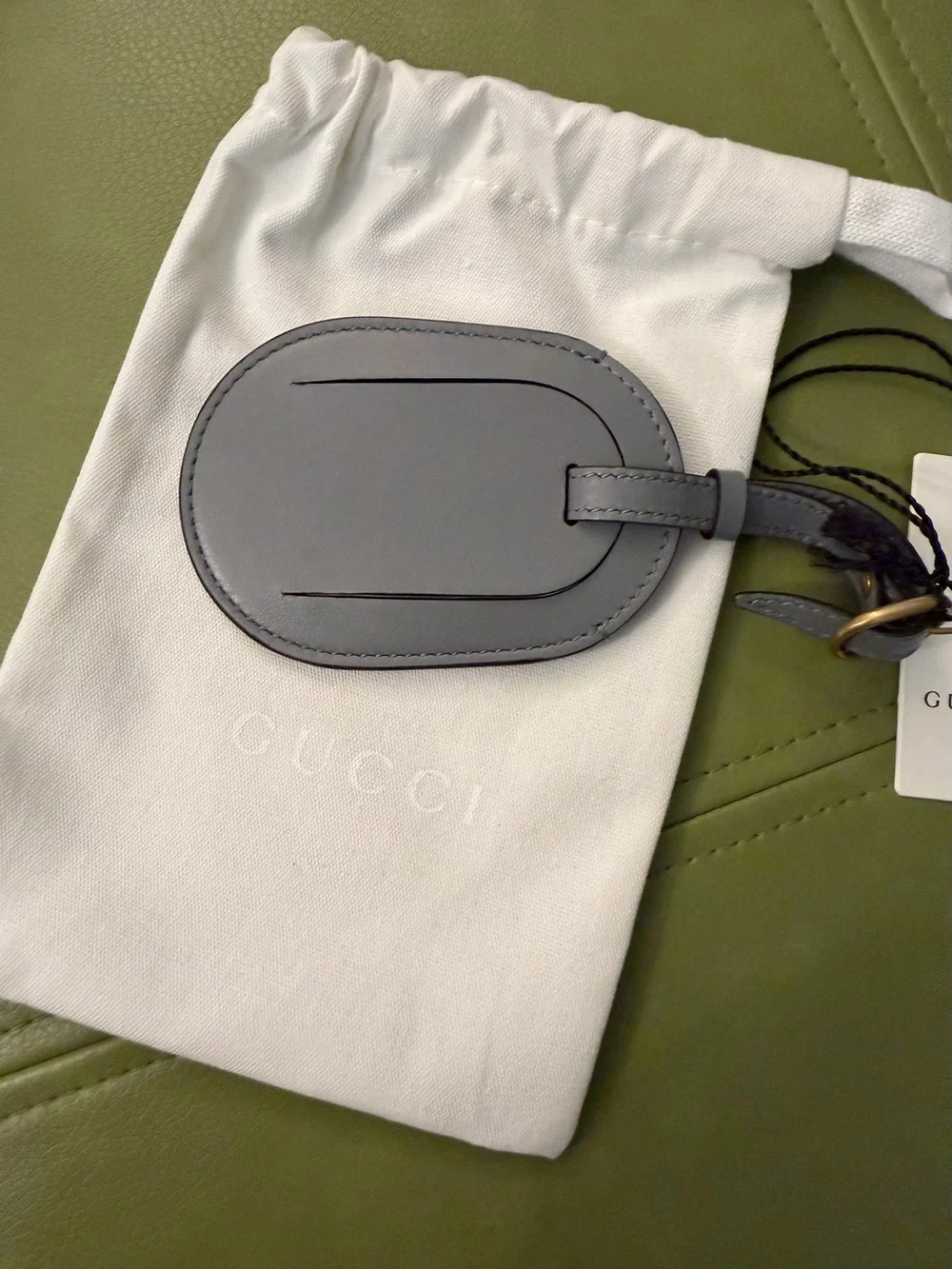 NWT Gucci Gray Oval Leather Luggage Tag with Embossed Logo